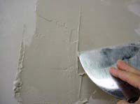 applying joint compound on a wall applying joint compound on a wall