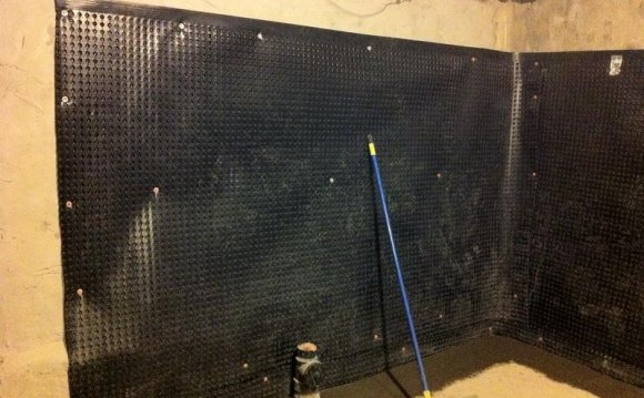 Interior basement walls waterproofing membrane