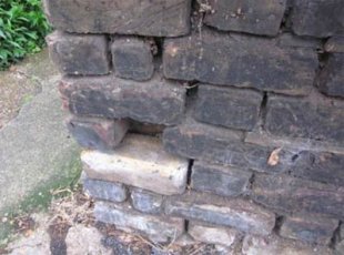 Cracked or missing mortar can let damp into your wall