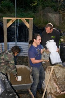 filling earthbags during construction