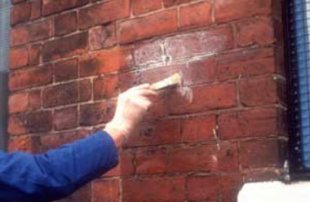 Painting masonry with waterproofer