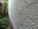 Wet cavity wall insulation