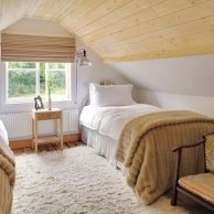 wood paneling used to warm the room in this refinished attic